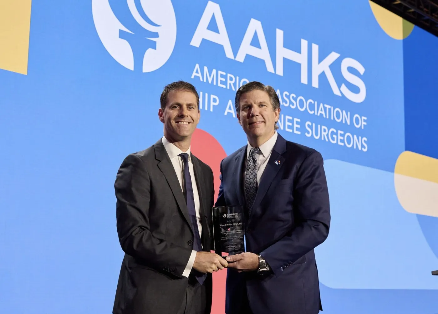 Dr Wayne Hoskins receiving the 2025 Surgical Techniques and Technologies Award from the American Association of Hip and Knee Surgeons